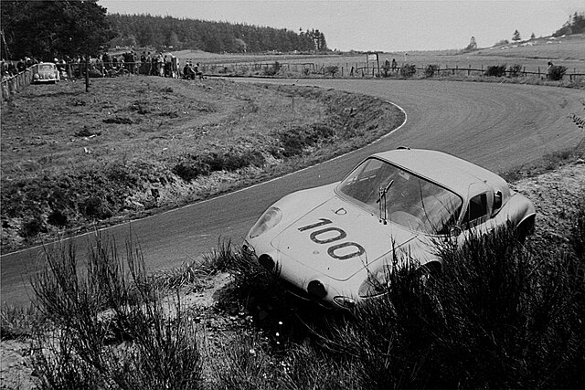 Porsche 718 GTR after the accident in the Aremberg curve, Nürburgring, during the 1000 km race, driven by Phil Hill. Hill was probably wired.