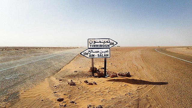 Road sign on the Trans-Saharan Highway in Niger. Turn right to go to Arlit